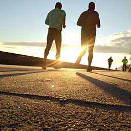People running at sunset